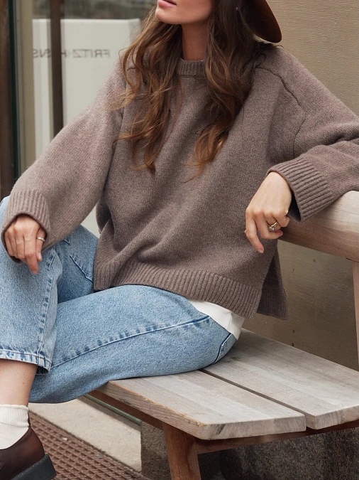 Taupe wool sweater with light-wash jeans