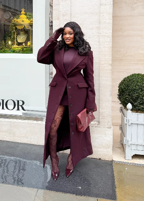 Sculpted burgundy coat with lace tights