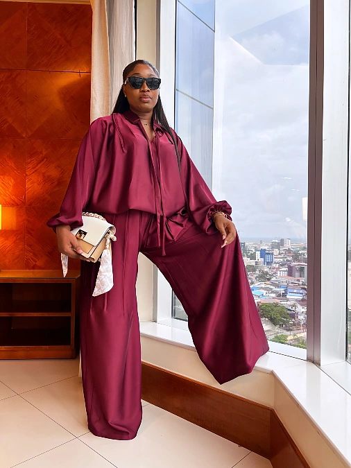 Burgundy satin blouse and wide leg trousers