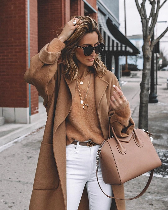 Camel coat and knit with crisp white jeans