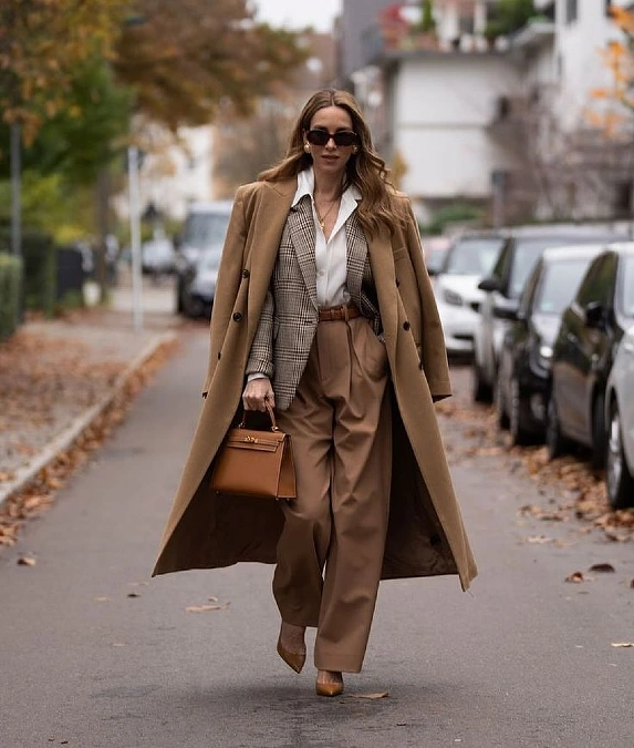 Layered camel coat with blazer and camel trousers