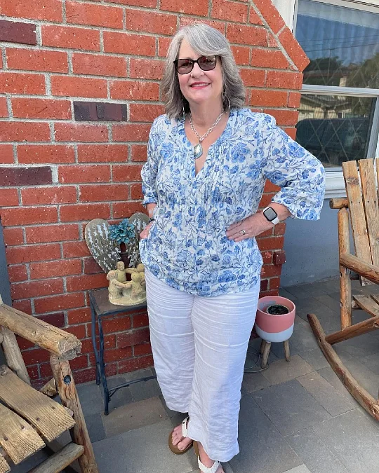 A Blue Floral Tunic and White Pants