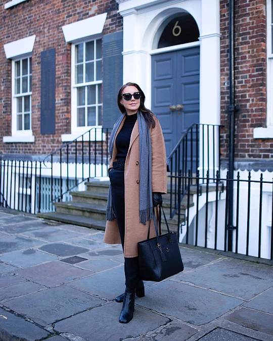 Camel Coat and Black Knit Layers
