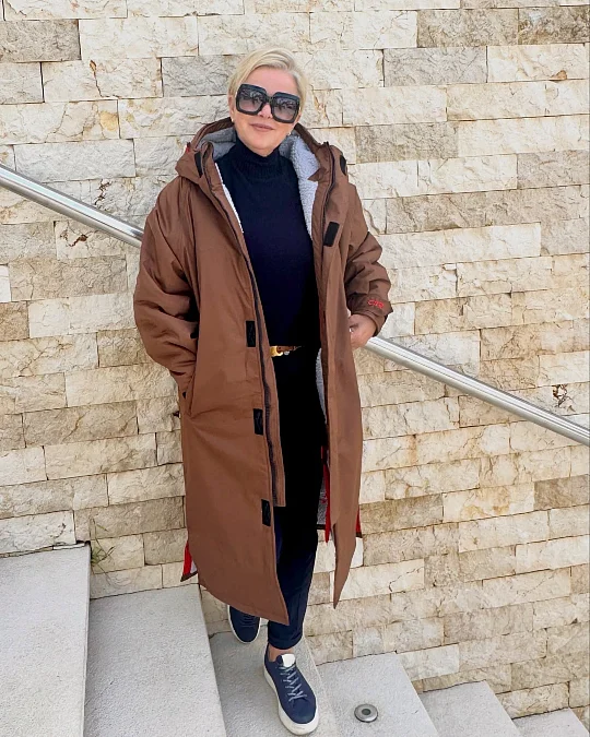 A Long Brown Coat With Navy Basics